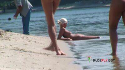 Playful blond nudist teen caught on camera naked at the beach - hclips.com