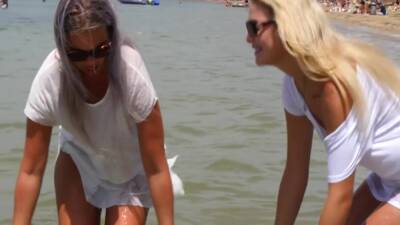 Two Young Sexy Blondes In Wet T-shirts In The Sea - hclips.com