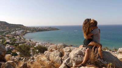 Beautiful Teen Couple In Love Passionately Kissing Above The Sea On Crete Island - upornia.com