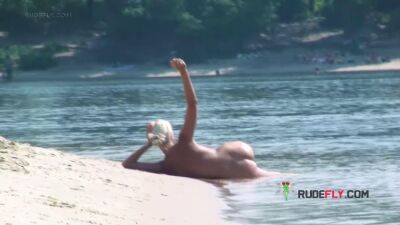 Playful blond nudist teen caught on camera naked at the beach - sunporno.com