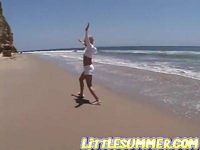 Petite teen lesbian fingered on the beach - hotmovs.com
