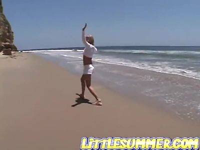 Petite teen lesbian fingered on the beach - txxx.com