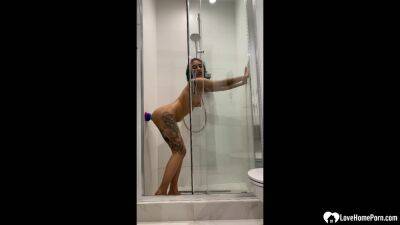 Tattooed teen gril fucking her sex toy in the shower - txxx.com