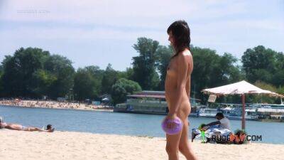 Petite nudist teen enjoys a beautiful day at the beach - hclips.com