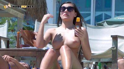 Cute nudist teen loves being topless on the beach - hclips.com