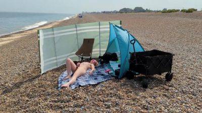 A Young Blonde Wife Is Nude And Masturbating On A British Public Beach - upornia.com - Britain