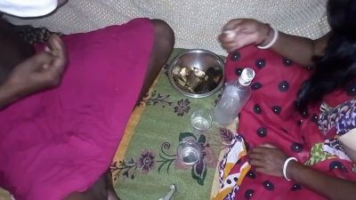 Dark-skinned woman in traditional scarf shares liquor before intimacy on floral blanket - yesvids.com